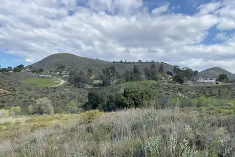 The Murrieta Hogbacks hillside rising above homes near Warm Springs Park and Preserve in Murrieta, California